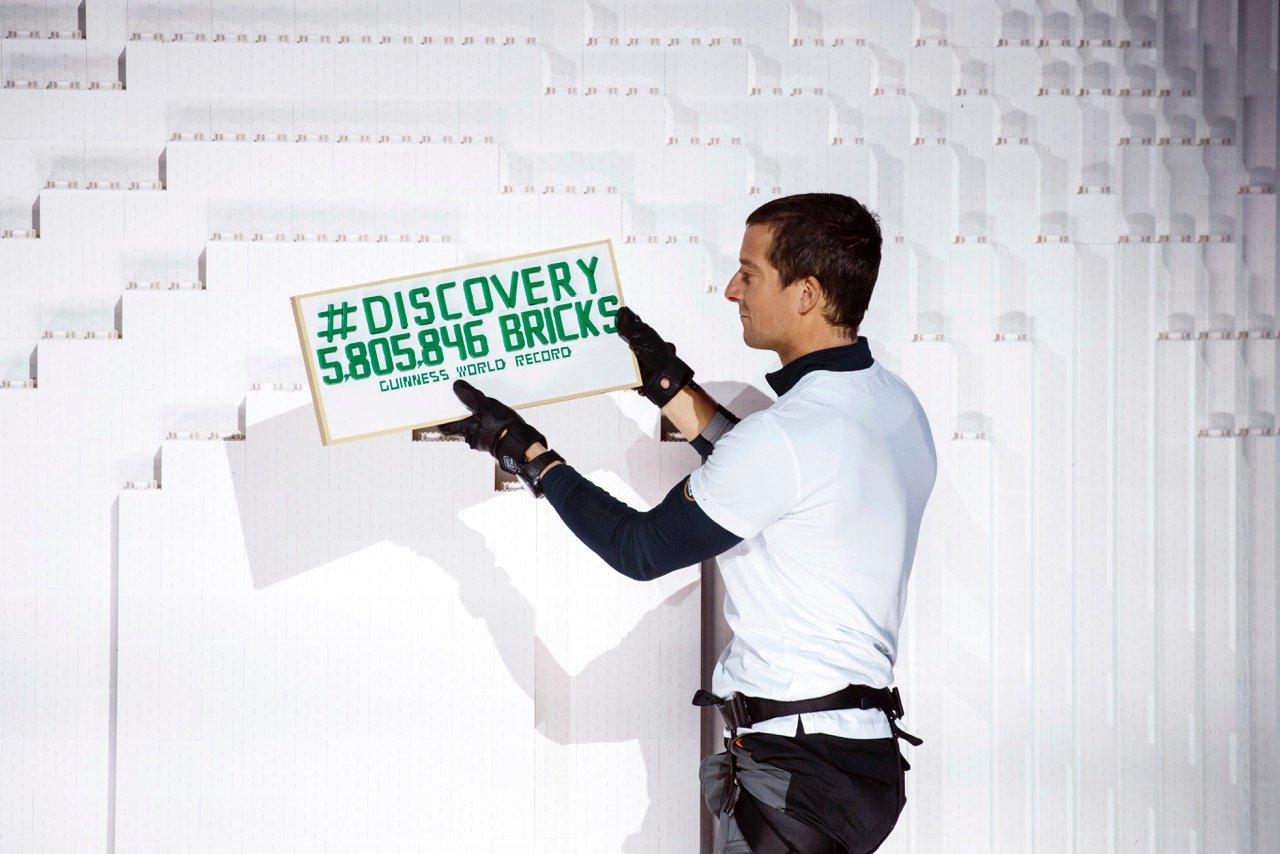 bear-grylls-lays-the-record-breaking-lego-brick-to-land-rovers-tower-bridge-structure-at-packington-hall-solihull